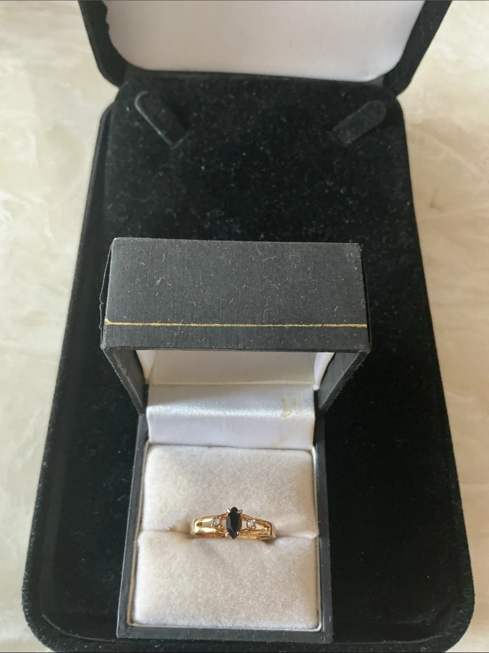 Gold Ring with Black Marquise Center and Clear Accent Stones